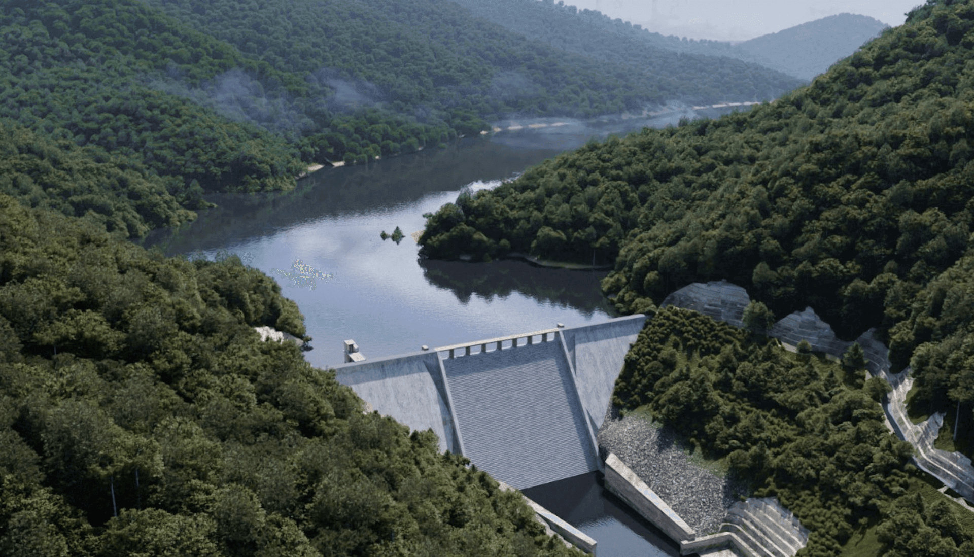 Aerial view of a large dam surrounded by lush green hills and a reservoir reflecting the sky.